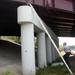Ann Arbor firefighter Lieutenant Keith Harr climbs a ladder as firefighter Steve Hubbard looks on as they prepare to rescue a stray cat found under an overpass along I-94 on Tuesday. Photos courtesy of Humane Society of Huron Valley